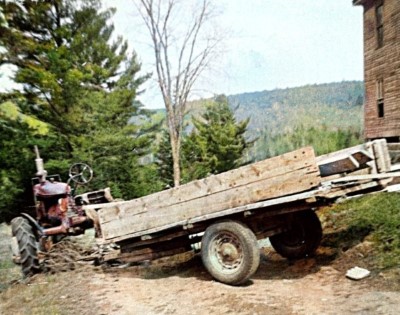 Our tractor pulling a trailer with lumber for the initial renovating.