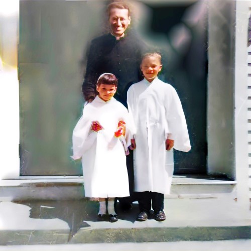 Father Mike, Mary Joan and I on our First Communion day.