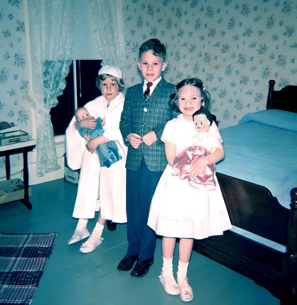 Louise, Paul, and Mary Joan on Louise's First Communion Day.