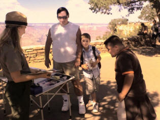 Michael helped Zach and Chris get special badges from the Grand Canyon ranger.