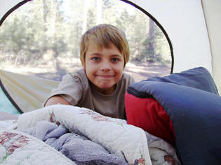 Nature Boy Zach in our tent at Bear Canyon Lake.
