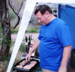 Michael cooking in camp.