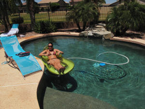 Rachel and the pool vacuum.