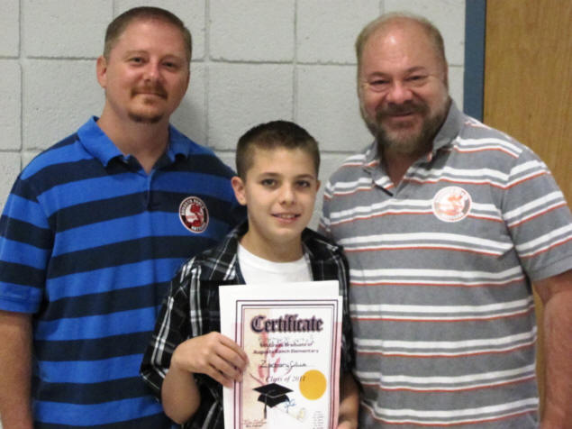 Jason, Zach, and Paul with Zach's diploma.