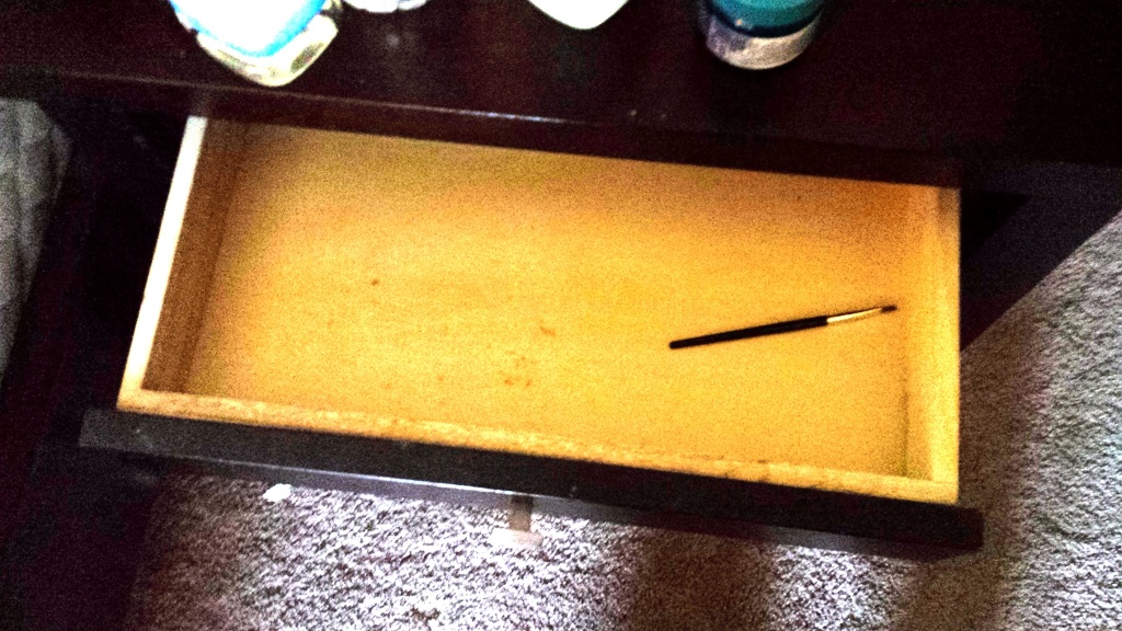 Paintbrush in drawer.