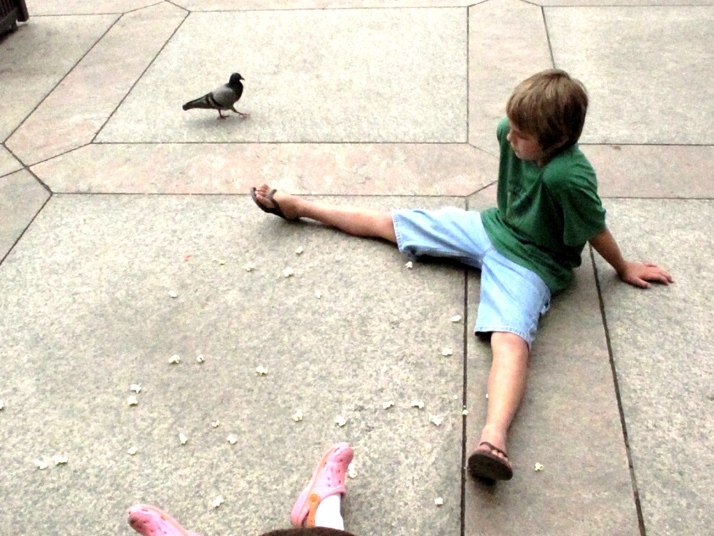 Zach feeding the pigeons.
