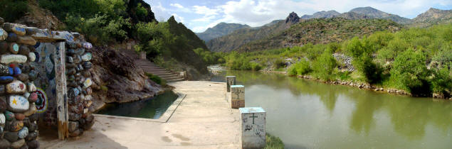Panorama: The remains of a private cabin, the public pool, and the view