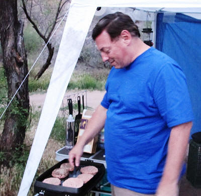 Michael cooking burgers.