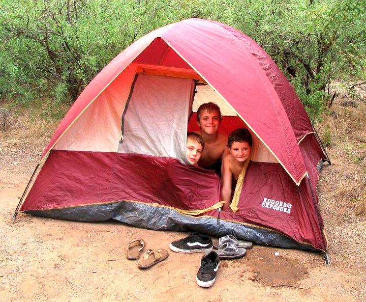 Zach, Josh and Lakota in their tent.