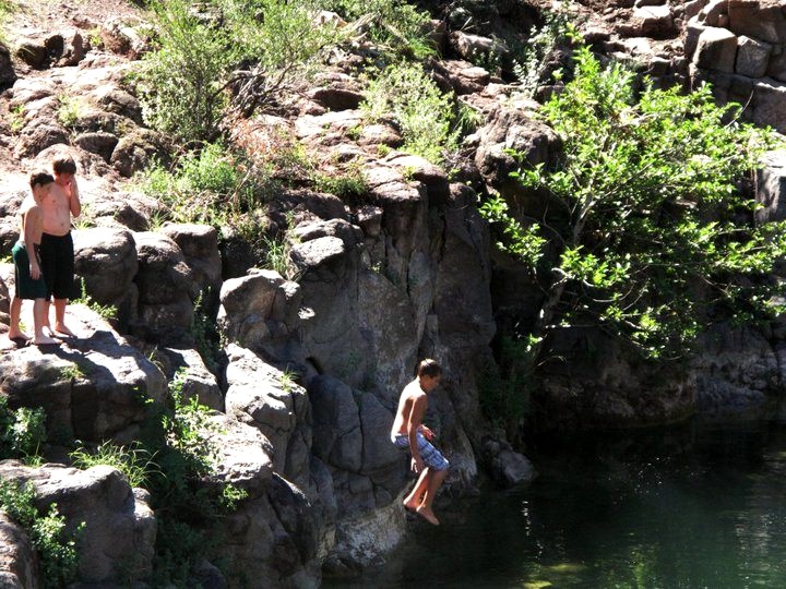 Zach cliff jumping into Fossil Creek.