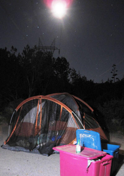 The moon shines above our campsite.