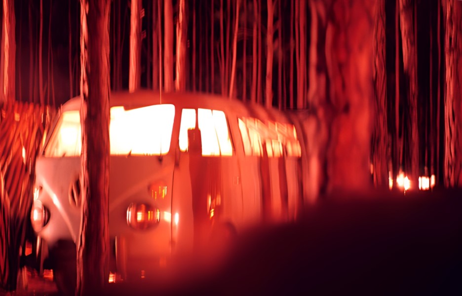 Time exposure of our microbus by the light of a dozen campfires.