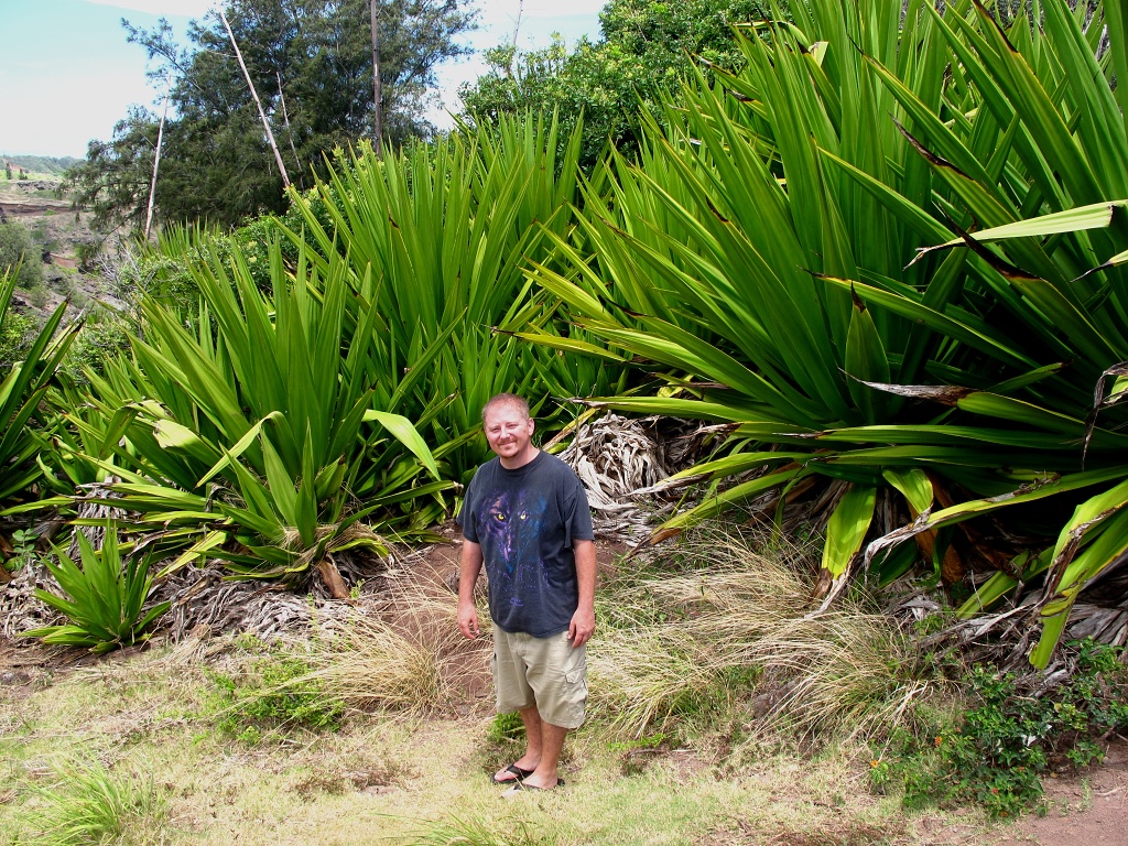 Jason in front of some really big plants.