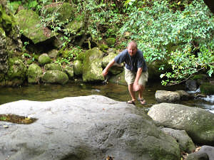 Jason jumping rocks in Iao Valley.